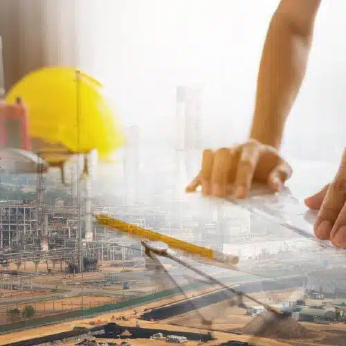 Refinery with overlay of hands reviewing blueprints, representing turnaround planning and facility design