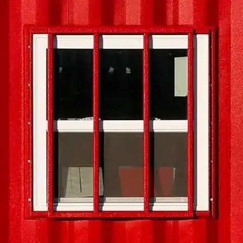Grilled security window on a red SiteBox