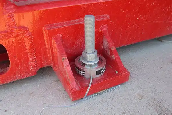 Load encoder on a test building anchor